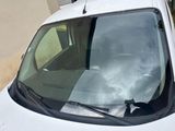 a white van that is parked on the side of the street
