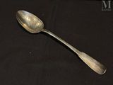 a spoon that is sitting on a black table