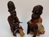 paire de figurines africaines représentant un homme et une femme assis sur une chaise