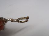 a person holding a small silver object in their hand