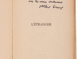 an open book with a handwritten quote on the cover