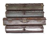 several pieces of luggage stacked on top of each other on a white surface
