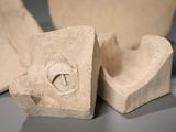 two pieces of stone that are sitting on a table