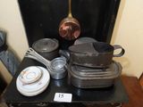 pots and pans sitting on top of a black stove top