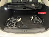 a trunk of a car with a bunch of wires in it