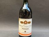 a bottle of wine that is sitting on a table
