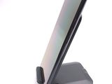 a cell phone that is sitting on a stand