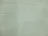 a picture of a piece of white fabric with a small hole in the middle of it