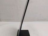 a tablet that is sitting on a stand on a table