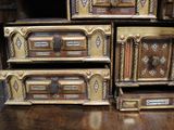 many wooden boxes stacked on top of each other on a table
