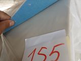 a person putting a piece of paper on top of a box