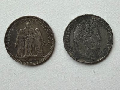 an old coin with a picture of a man and a woman on it