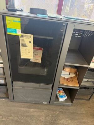 an image of a microwave in a store with a lot of boxes