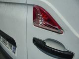a close up of a white van with a black handle