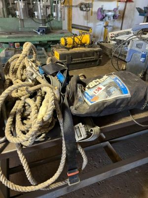a bunch of rope on a table in a workshop