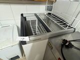 a dishwasher that is sitting in a kitchen next to a sink