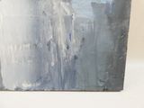 un tableau posé sur une table, sur fond blanc