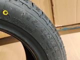 tire of a motorcycle on a stand in front of a cardboard box