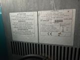 two signs on the side of a machine that is not working