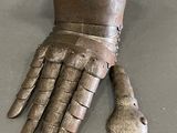 a metal glove that has been placed on top of a table