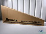 a close up of a cardboard box with a guitar in it