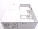 a box with a charger inside of it on a white surface