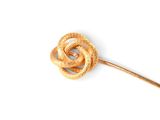a knot on a stick on a white surface