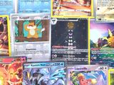 many different types of pokemon cards on the table