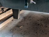 a close up of a machine that is working on a piece of metal