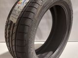 a close up of a tire on a white surface