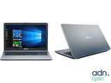 two laptops side by side on a white background with a windows 10 logo