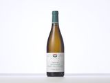 a bottle of white wine sitting on top of a table