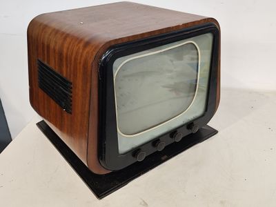 a small television sitting on top of a white table