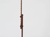 an antique wooden floor lamp with a metal pole on a white background