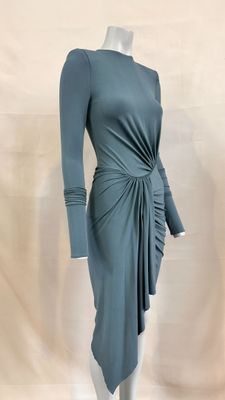the mannequin is wearing a blue dress with a knot around the waist