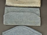four different colors of felt headbands laid out on a table