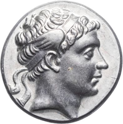 a close up of a coin with a woman ' s head on it