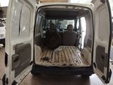 a white van that is parked in a garage
