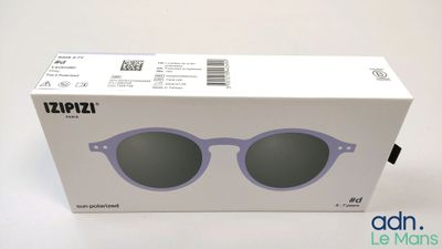 the box of a pair of sunglasses is open on a white surface
