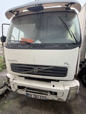 a white truck that is parked on the side of the road