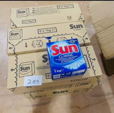 a box of sun soap sitting on top of a cardboard box