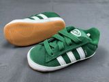 a close up of a pair of green and white shoes