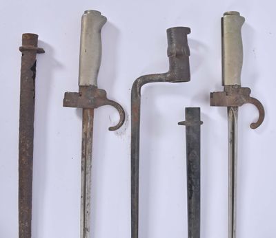 four different types of old tools are displayed on a white surface