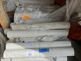 many rolls of toilet paper on the pallets