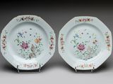 pair of chinese porcelain plates with flowers and birds on them