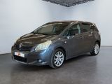 the grey toyota sienna is parked in the garage of a building