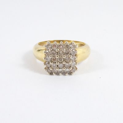 an image of a diamond cluster ring on a white background