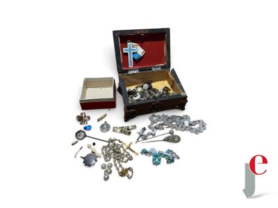 a small box with a bunch of jewelry inside of it