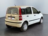 a small white car that is parked in a room