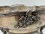 a silver bowl with a design on it on a table